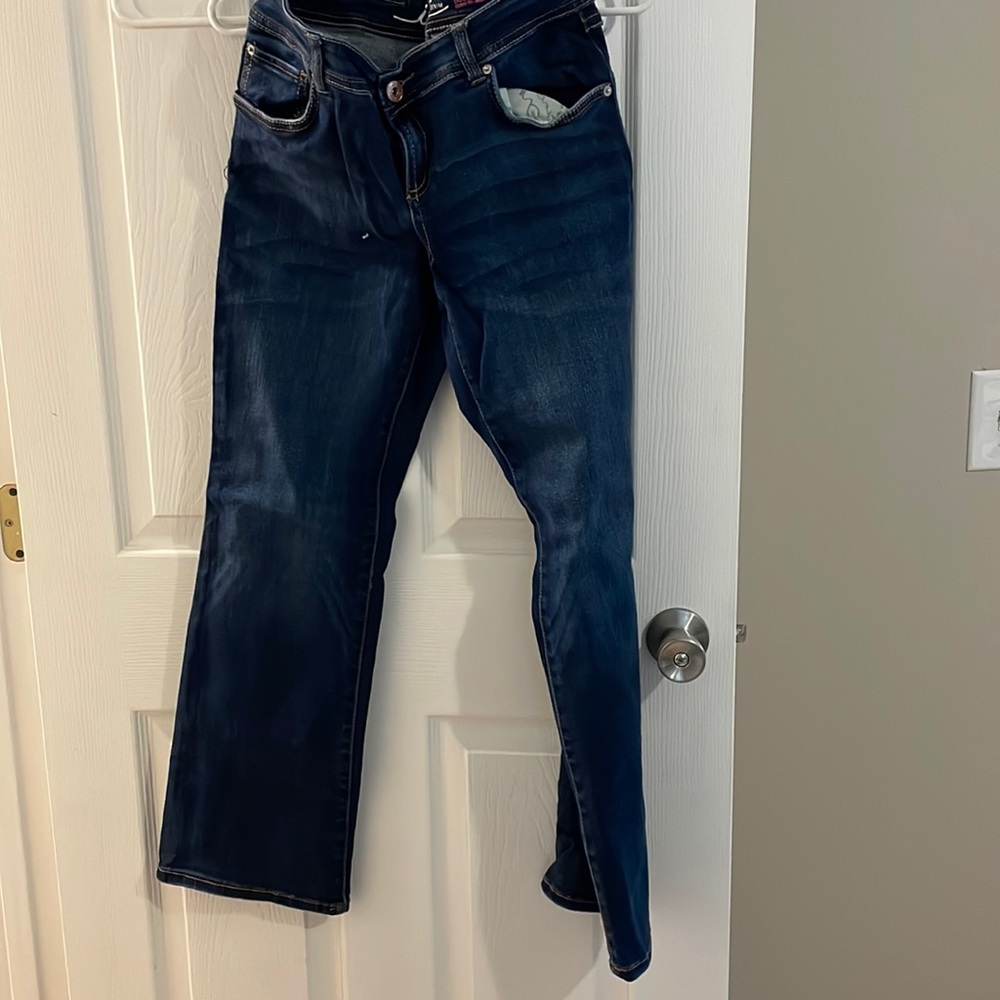 Blue stretchy jeans. Boot leg curvy fit.